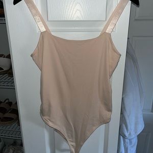 Brand new forever 21 blush pink body suit. Size S. Tags still on. Never worn.